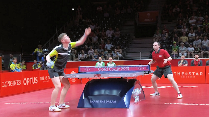 Northern Ireland's Owen Cathcart serving to England's Paul Drinkhall