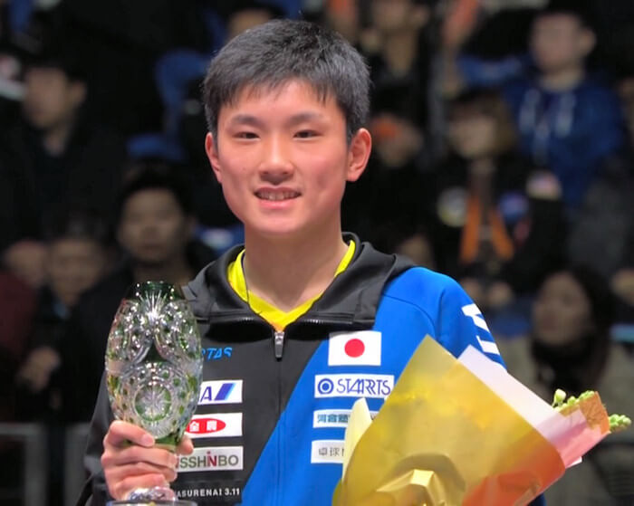 2018 ITTF World Tour Grand Finals - Tomokazu Harimoto with the winners trophy