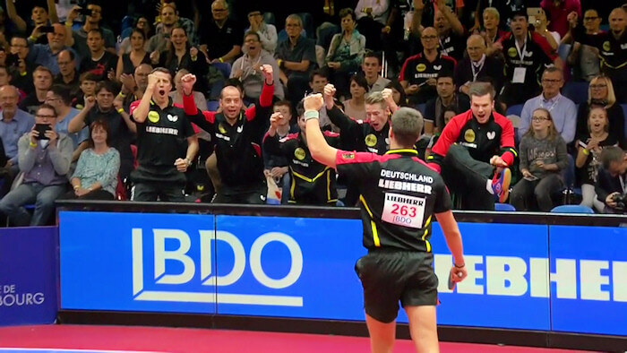 Patrick Franziska celebrates his victory with his German team mates