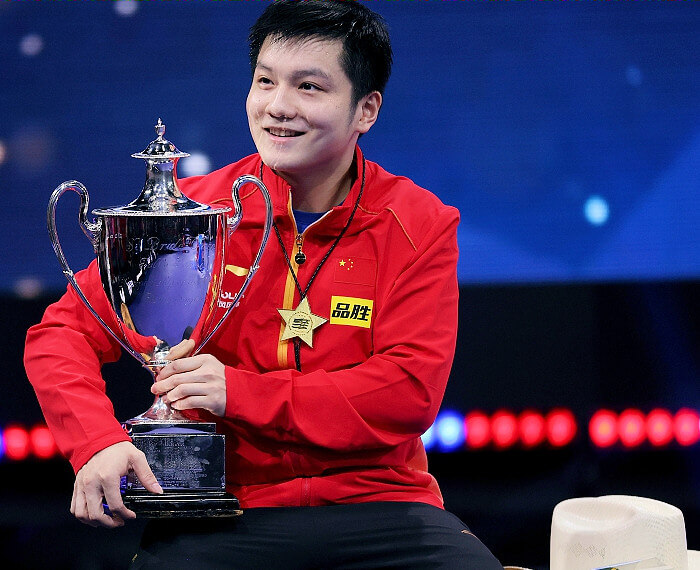 Fan Zhendong (China) with Mens Singles trophy
